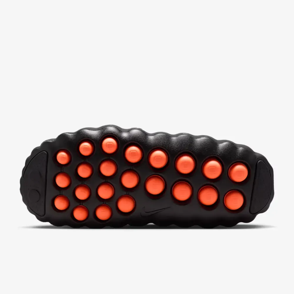 Outsole of the Nike Mind 001 with large orange massaging nodules